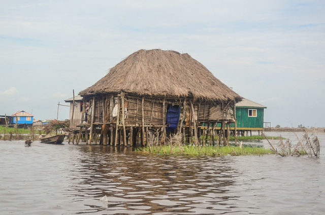 All of Ganvie's houses, shops and restaurants are built on wooden stilts several feet above the water. Photo Credit