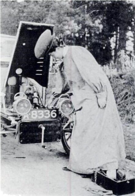 Dorothy Levitt priming a carburettor and wearing an early version of a motoring 'duster' coat.Source: Wikipedia/Public Domain