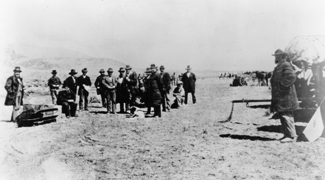 The scene at Lee's execution by Utah firing squad on March 23, 1877. Lee is seated, next to his coffin. Wikipedia/Public Domain