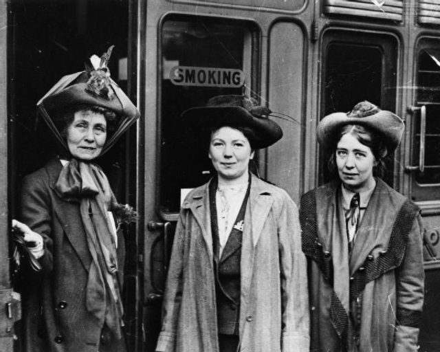 Mrs Emmeline (left) and her daughters Christabel and Sylvia at Waterloo Station, London.