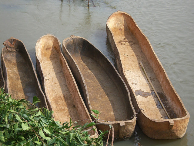 There are lots of boats hand-carved from wood trunks. Photo Credit