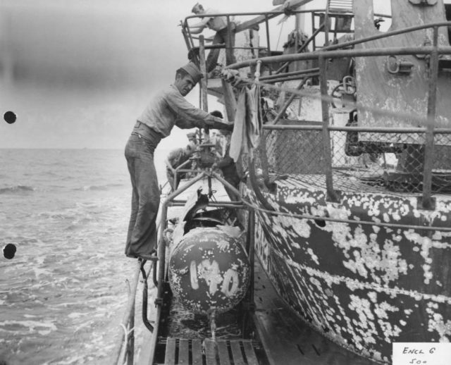 View of forward end of damaged torpedo on U-505.