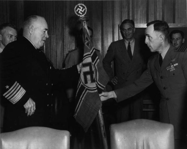 Task Group 22.3 Commander, Captain D. V. Gallery, presenting U-505’s flag to ADM Jonas H. Ingram at Navy Department, Washington D.C.