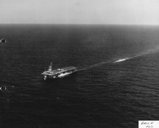Aerial view off the port bow showing U-505 in tow