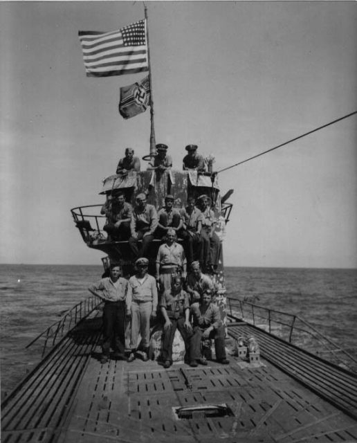 Salvage party in front of the conning tower of “JUNIOR”, (U-505).