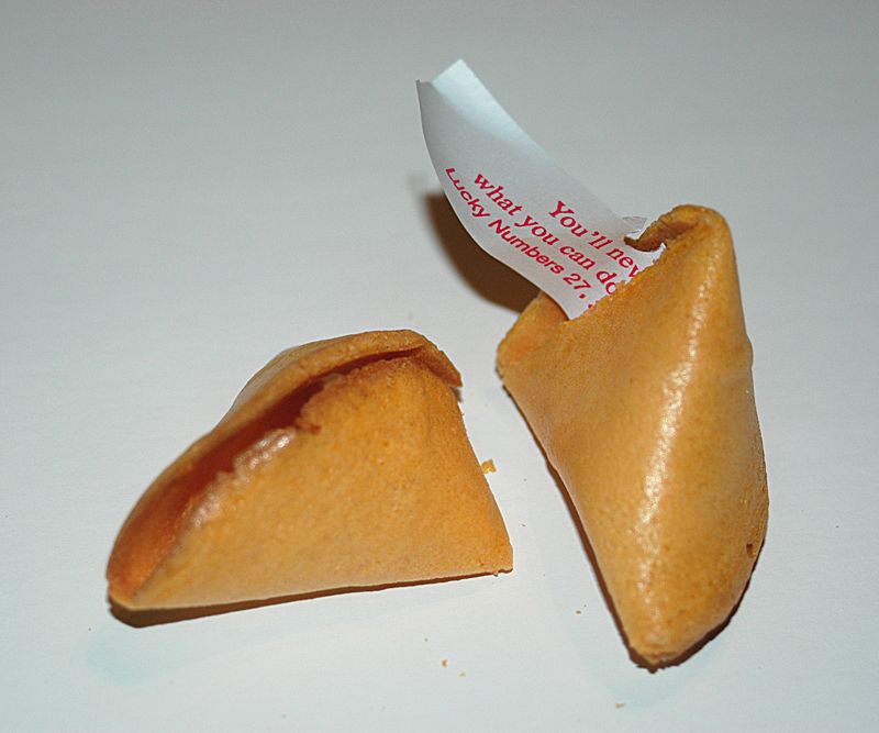 An opened fortune cookie. Photo Credit