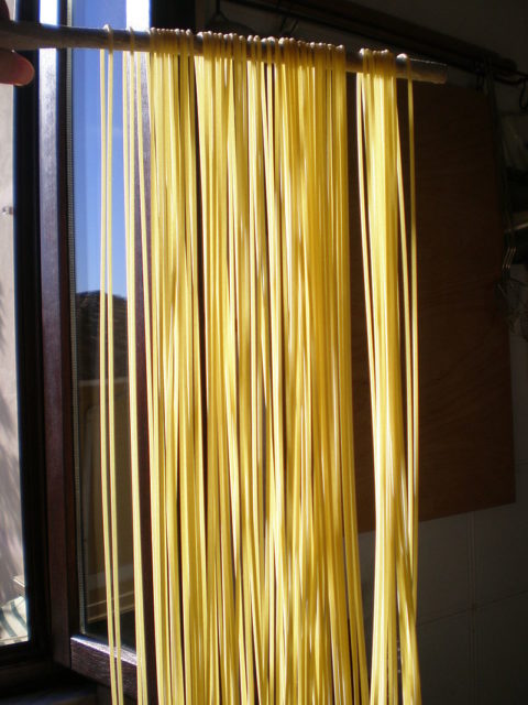 Spaghettoni being dried. Photo credit