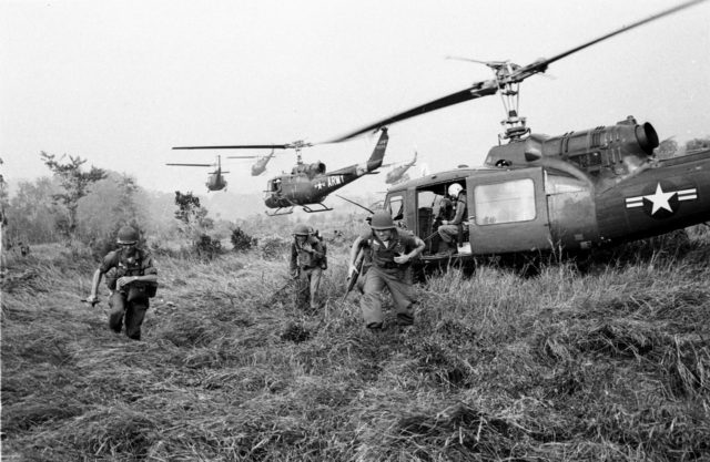 American soldiers are dropped off by U.S.Army helicopters to join South Vietnamese ground troops to advance in an attack on a Viet Cong camp 18 miles north of Tay Ninh, northwest of Saigon near the Cambodian border, in March 1965 during the Vietnam War. (AP Photo/Horst Faas)