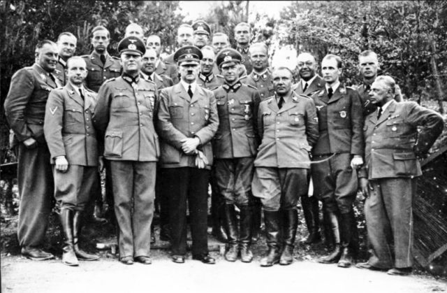Theodor Morell with Hitler, behind Martin Bormann and Nicolaus von Below in Wolfsschanze in 1940. Photo credit