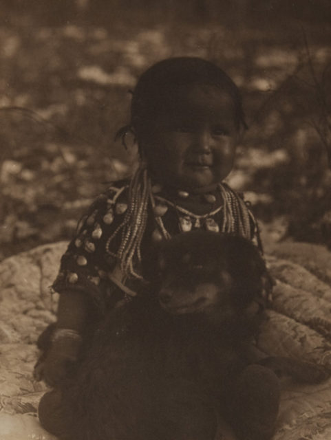 Native american child and dog