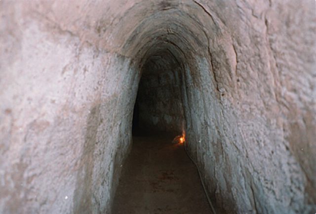 Part of the tunnel complex at Củ Chi, this tunnel has been made wider and taller to accommodate tourists. Photo Credit