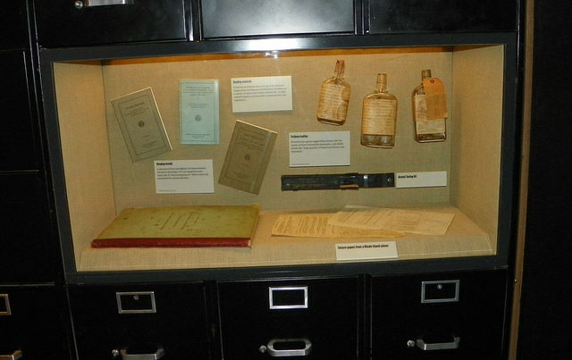 Reading materials, evidence bottles, alcohol testing kit, seizure papers from a Rhode Island saloon, etc. Photo Credit