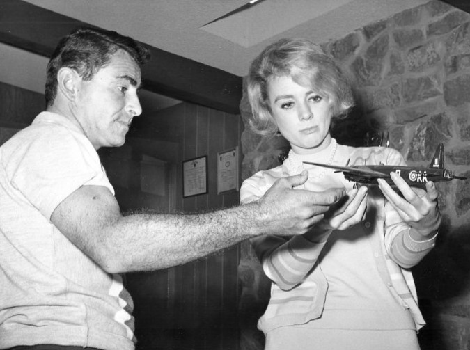 Rod Serling models an airplane with actress Inger Stevens, who appeared in "The Hitch-Hiker" and "The Lateness of the Hour"