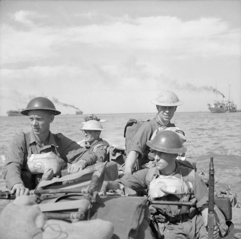 British troops in a landing craft make their way ashore on Ramree Island, 21 January 1945.