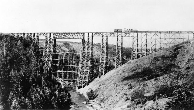Montana’s massive 214 foot high Two Medicine Creek timber trestle on the Great Northern Railway