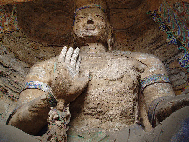 One of the larger statues at Yungang. Photo Credit