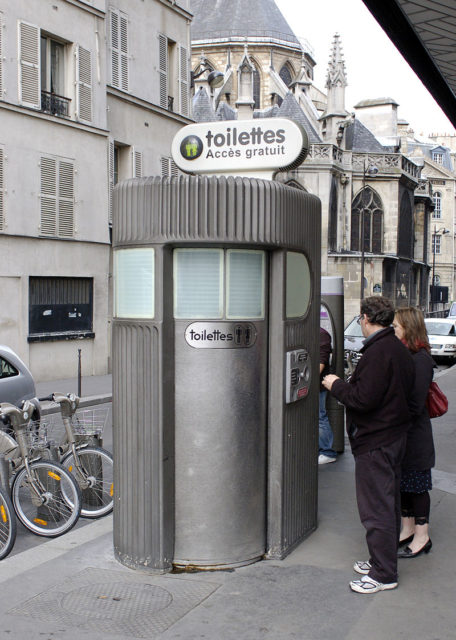 A freestanding, coin-operated pay toilet stall in Paris