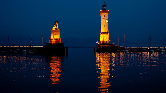 The lighthouse stands at about 108 feet tall and is located at the end of the western mole sheltering the town of Lindau's harbor. Photo Credit