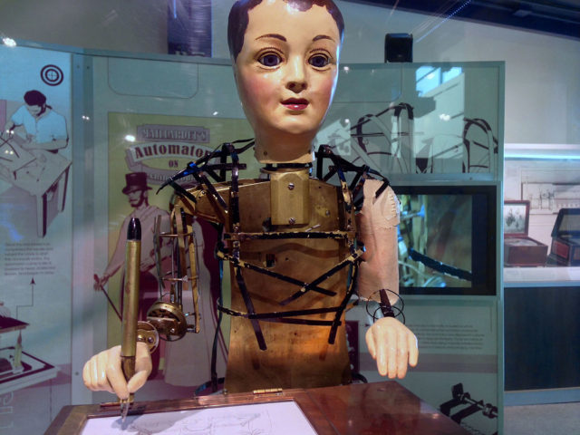Maillardet's automaton was fully clothed during the period when it was exhibited. Now it is stripped in order to show the clockworks in motion. Photo Credit 