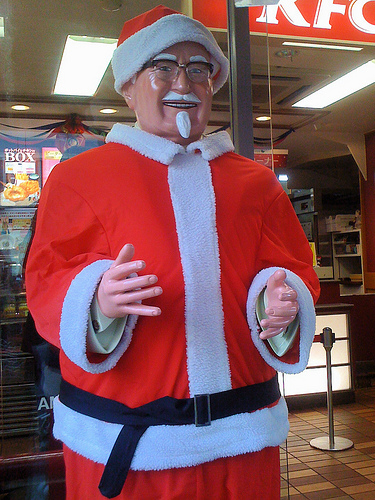 Colonel Sanders dressed in Santa suit. Photo Credit