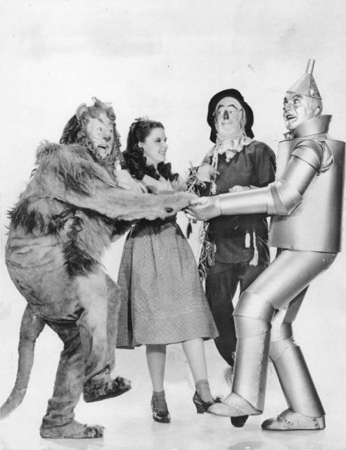 The film's main characters (left to right): the Cowardly Lion, Dorothy, Scarecrow, and the Tin Man