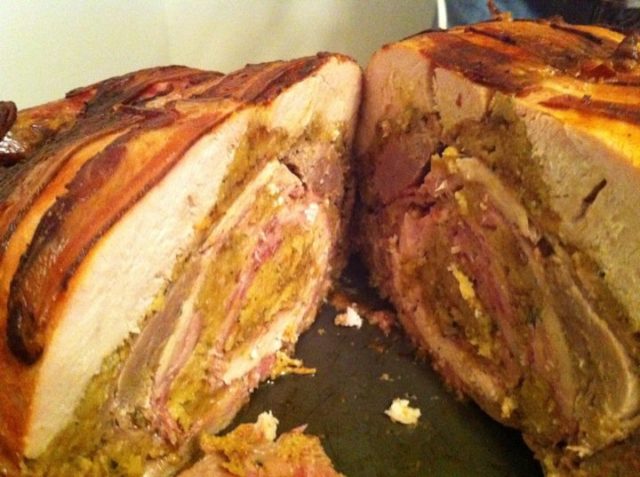 Cross-section of a turducken including a hen in the center with cornbread stuffing.