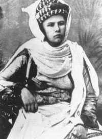 Eberhardt dressed as a man, wearing a burnous and turban.