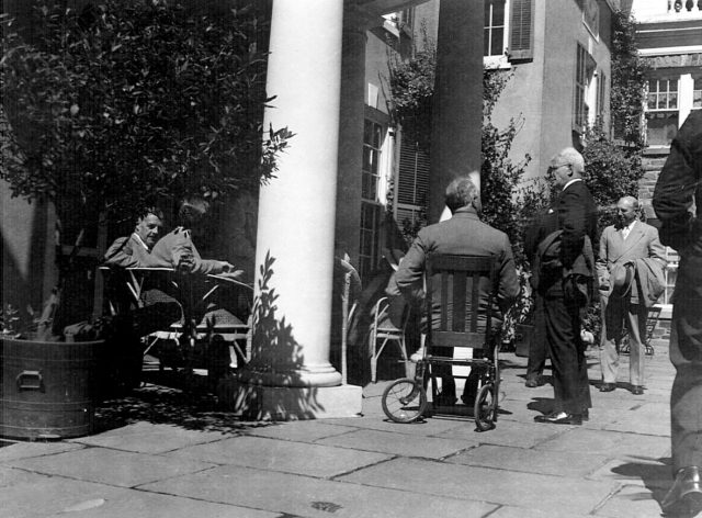 FDR in his wheelchair with a group assembling on the terrace of Springwood, before a Hudson River cruise on the USS Potomac (September 12, 1937) Photo Credit