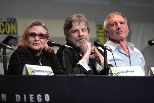 Fisher with fellow Star Wars actors Mark Hamill and Harrison Ford.Photo Credit