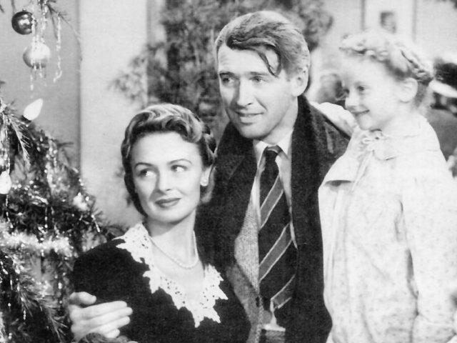 George Bailey (James Stewart), Mary Bailey (Donna Reed), and their youngest daughter Zuzu (Karolyn Grimes)