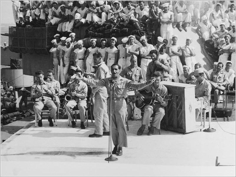 Irving Berlin singing and conducting aboard USS Arkansas, 1944