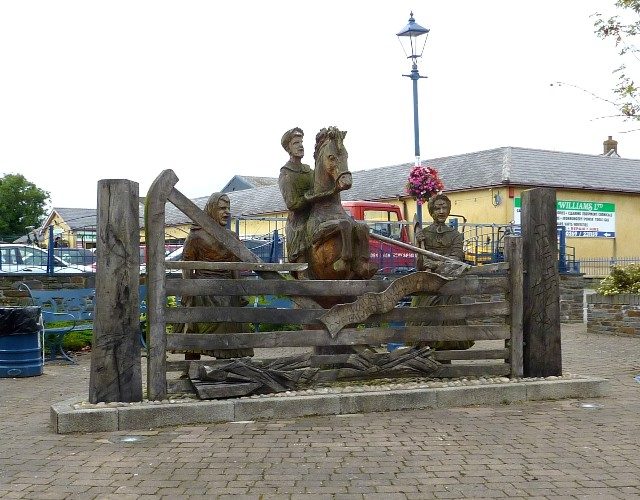 Rebecca and her daughters, wooden sculpture in St Clears. Photo credit