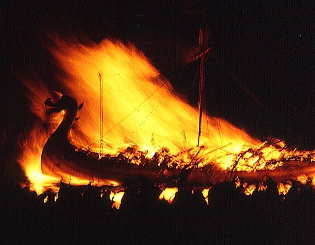 The Burning Galley. Once the galley has burned and the flames die down, guizers sing the traditional song “The Norseman’s Home” before a night of partying begins. Photo Credit