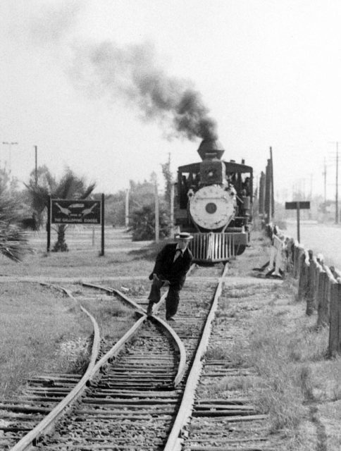 Keaton feigning his foot stuck in the railroad tracks of a train ride at Knott’s Berry Farm in 1956. Photo Credit