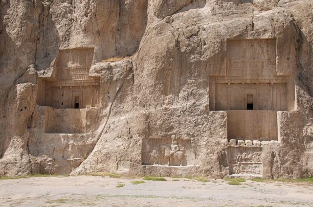 From left to right, the tombs of Artaxerxes I and Darius the Great, with Sassanid-era bas-reliefs below. Photo Credit