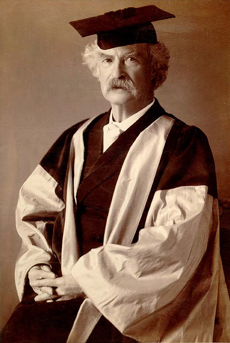 Mark Twain in his gown (scarlet with grey sleeves and facings) for his D.Litt. degree, awarded to him by Oxford University