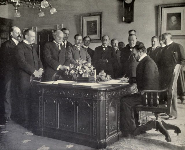 John Hay signing the Treaty of Paris, memorandum of ratification on behalf of the United States, 1899.