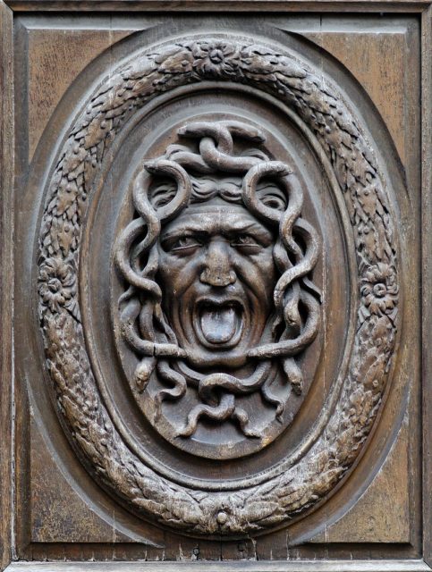A wooden door panel intended to guard the house from an unwelcome guest