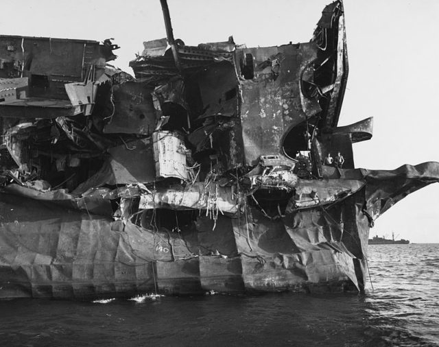 USS Independence “Gilda” test damage aft port quarter (note two sailors on the aft deck)