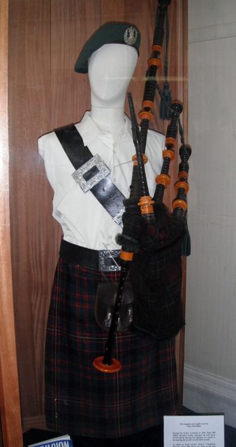 Bill Millin’s bagpipes on display at Dawlish Museum along with his bonnet, 100-year-old kilt, and dirk. Allegedly, there has been a mix-up and misunderstanding between Millin and the Pegasus Memorial Museum at Ranville, France, as Millin apparently used two sets of bagpipes during the war. Photo Credit