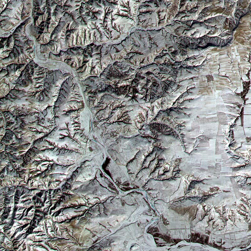 A satellite image of a section of the Great Wall in northern Shanxi, running diagonally from lower left to upper right and not to be confused with the more prominent river running from upper left to lower right.