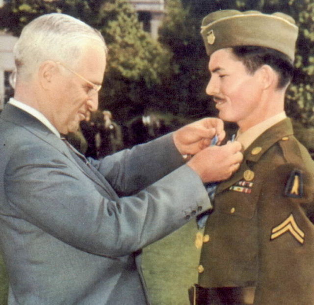 President Harry Truman awarding the Medal of Honor on conscientious objector Desmond Doss.