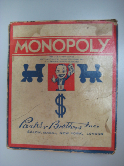 Box lid of a Parker Brothers published copy of Monopoly (the “Number 7 Black Box Edition”) from circa 1936–1941.
