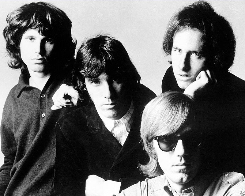 Photo of the rock group The Doors. From left-Jim Morrison, John Densmore, Robby Krieger and seated, Ray Manzarek.