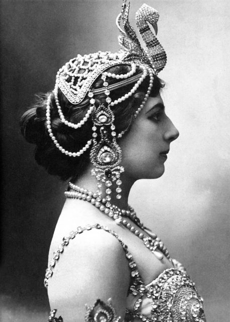 In 1910, wearing head jewelry.