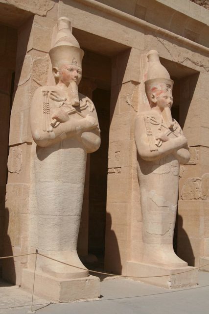 Osirian statues of Hatshepsut at her tomb, standing at each pillar of the great structure  Photo Credit