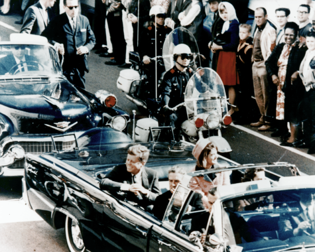 Picture of President Kennedy in the limousine in Dallas, Texas, on Main Street, minutes before the assassination. In the presidential limousine are Jackie Kennedy, Texas Governor John Connally, and his wife, Nellie