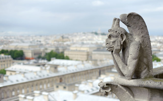 One of the famous grotesques at Notre Dame in Paris  Photo Credit
