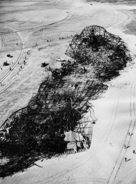 The wreckage of the Hindenburg the morning after the crash. Note the fabric remaining on the tail fins.