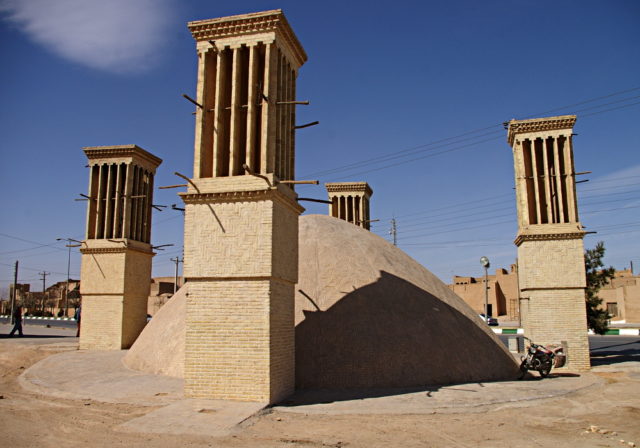 A clear photo showing the reservoir dome with its four wind towers (badghirs), Yazd, Iran  photo credit
